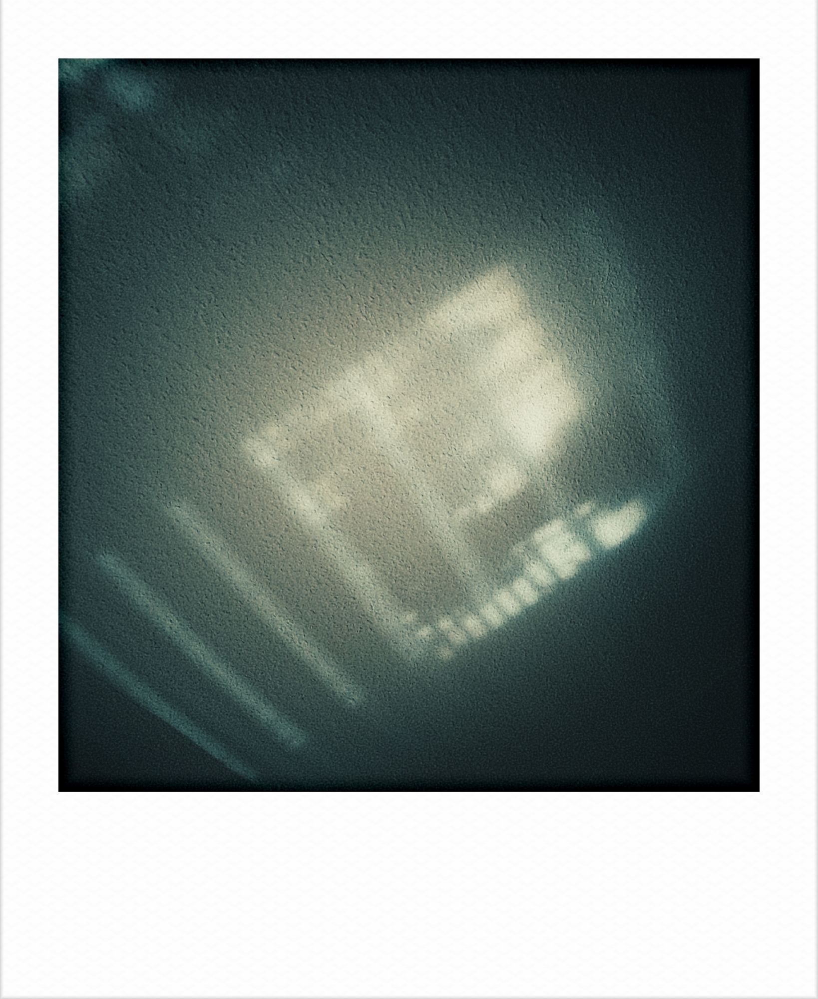 Shadows of windowblinds and plants on a ceiling.