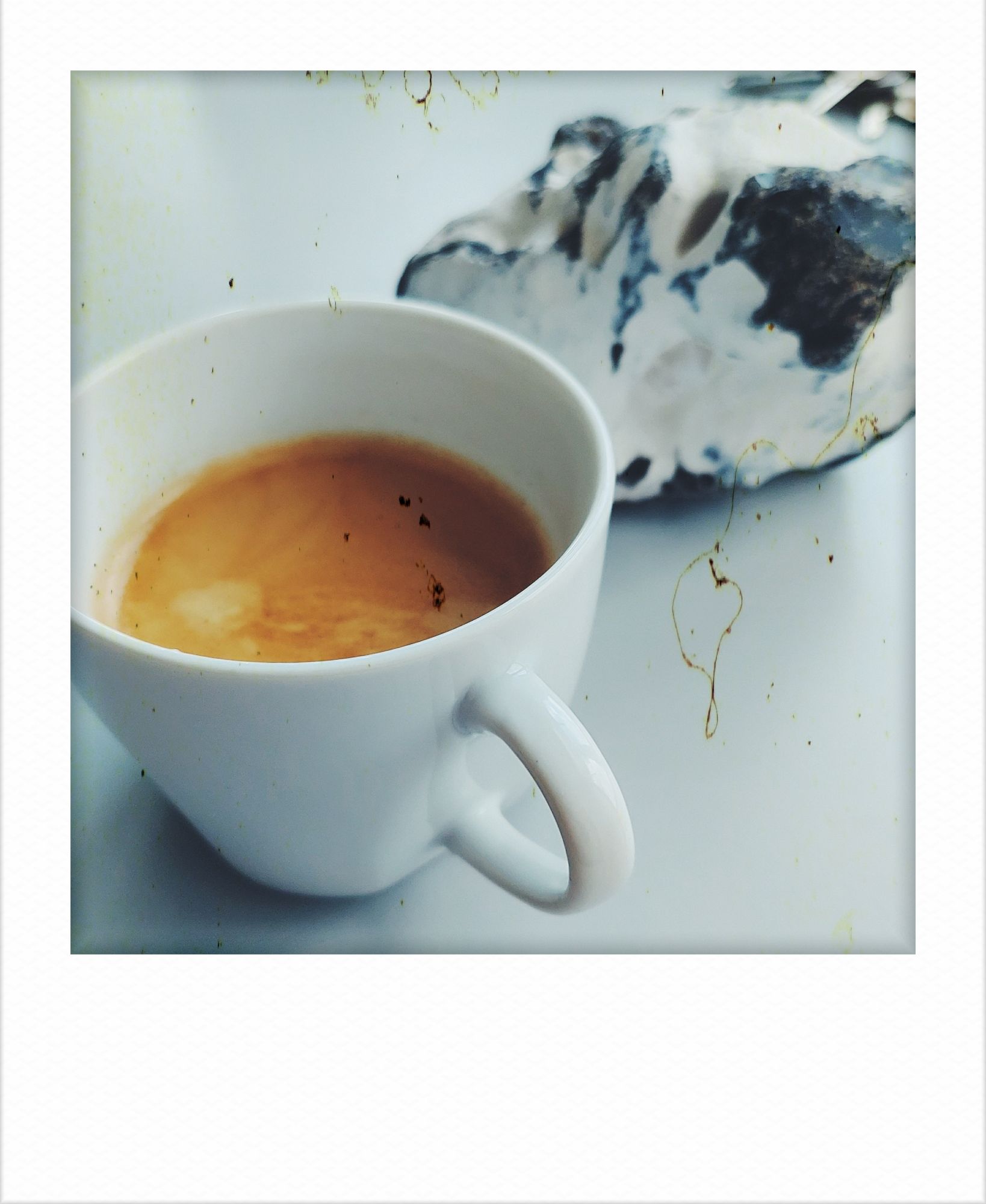 A coffee cup and an island rock.